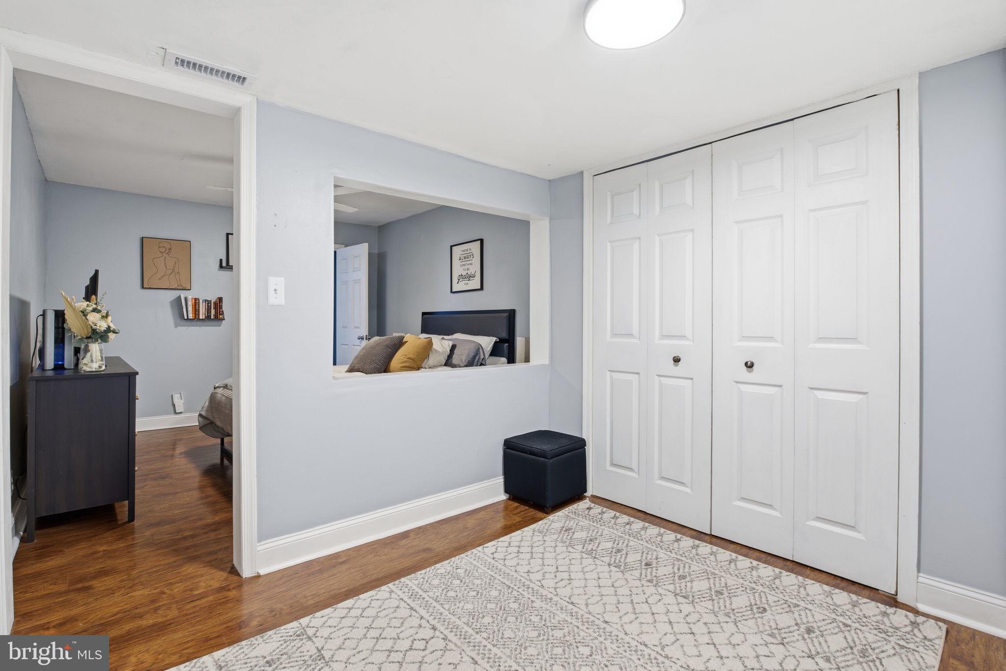1433 Patapsco Street Baltimore, MD 21230 - Photo 14 of 26 a view of a bedroom with a bed and workspace