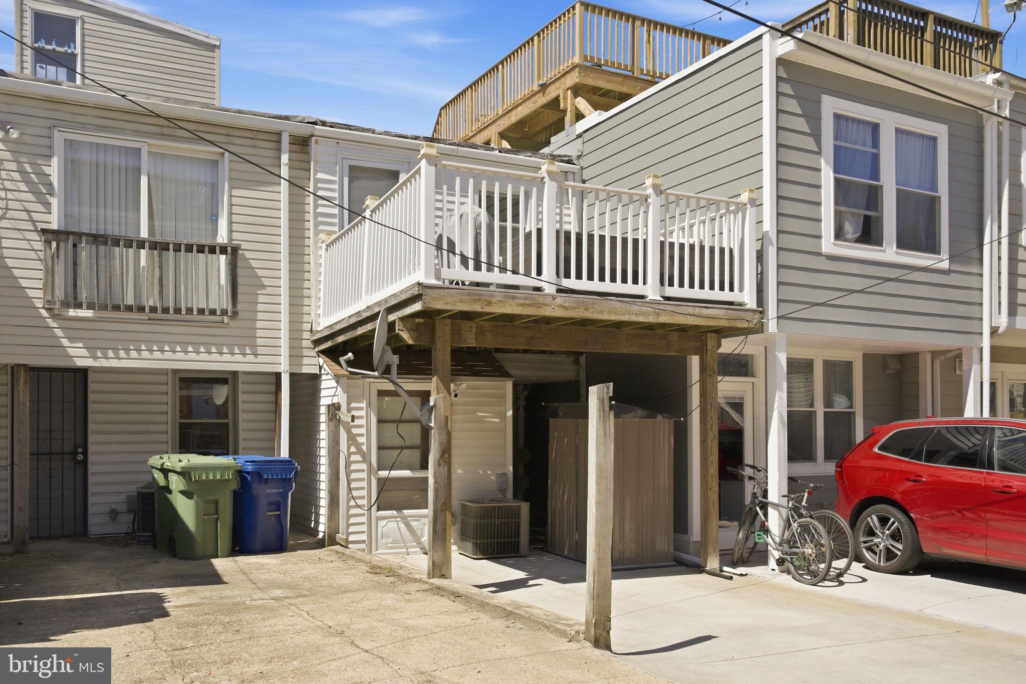 1433 Patapsco Street Baltimore, MD 21230 - Photo 25 of 26 a front view of a house with a yard