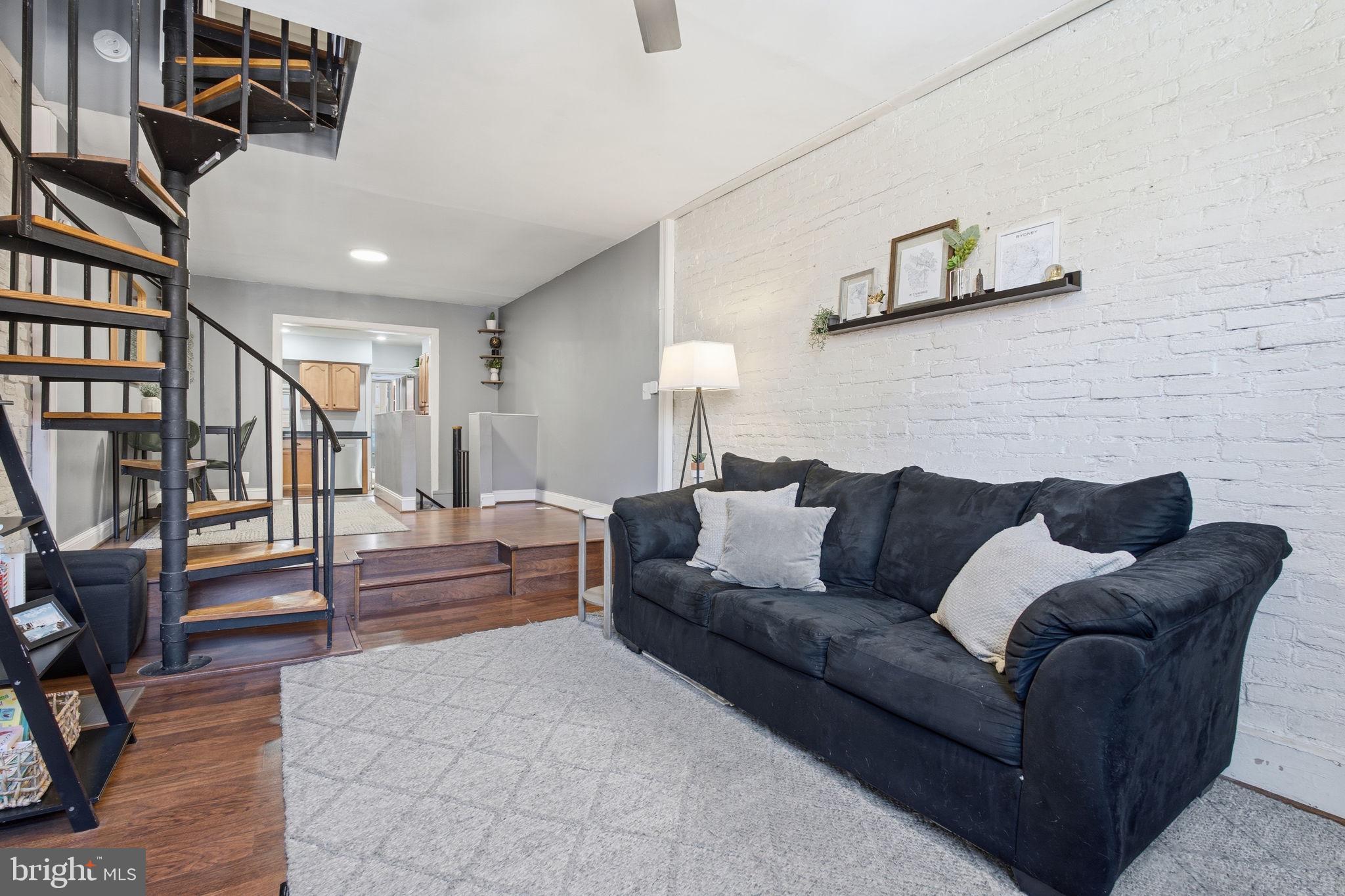 1433 Patapsco Street Baltimore, MD 21230 - Photo 4 of 26 a living room with furniture and wooden floor