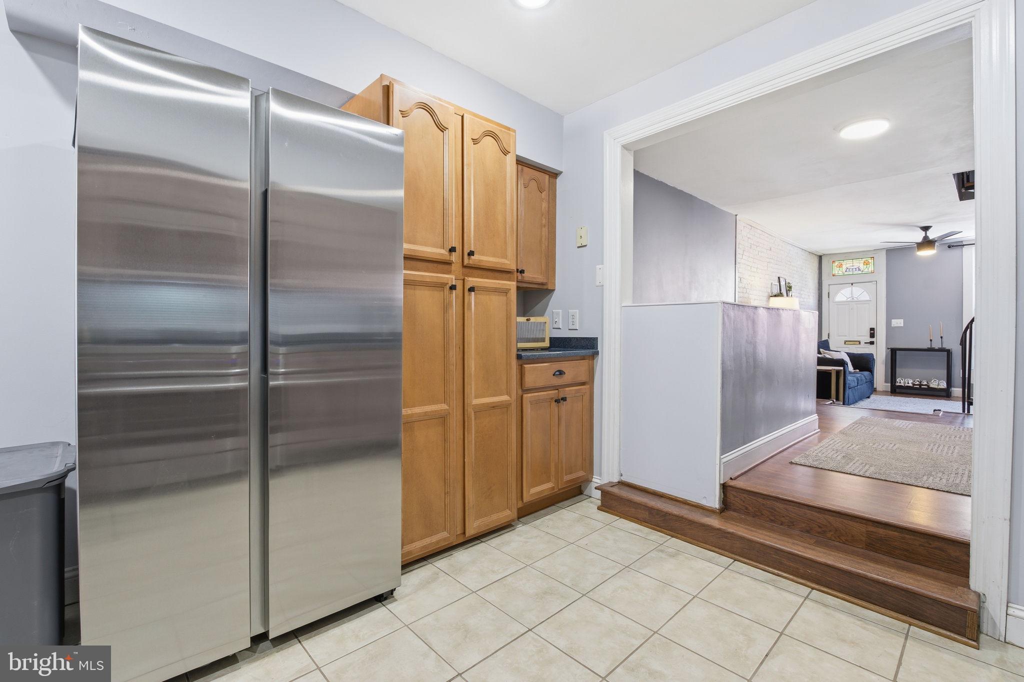 1433 Patapsco Street Baltimore, MD 21230 - Photo 9 of 26 a kitchen with a refrigerator and a sink