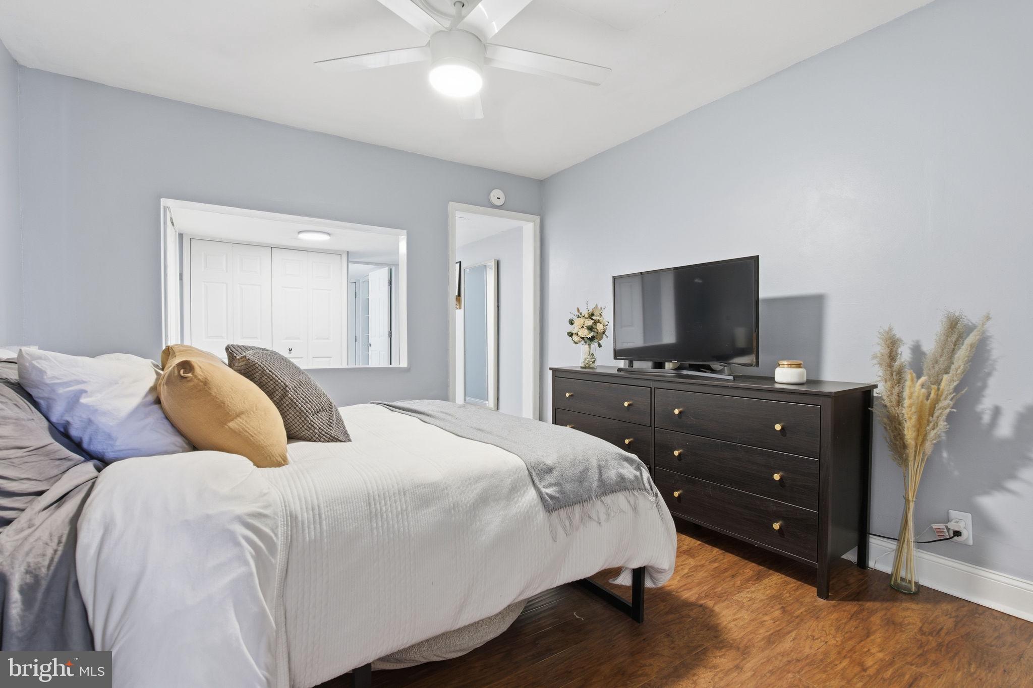 1433 Patapsco Street Baltimore, MD 21230 - Photo 10 of 26 a bedroom with a bed and a television