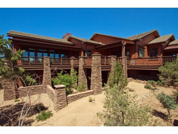 4465 Fort Bridger Road Prescott, AZ 86305 - Photo 1 of 23 a backyard of a house with yard and outdoor seating
