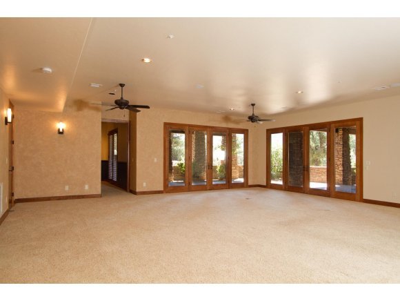 4465 Fort Bridger Road Prescott, AZ 86305 - Photo 16 of 23 a view of a big room with windows and chandelier