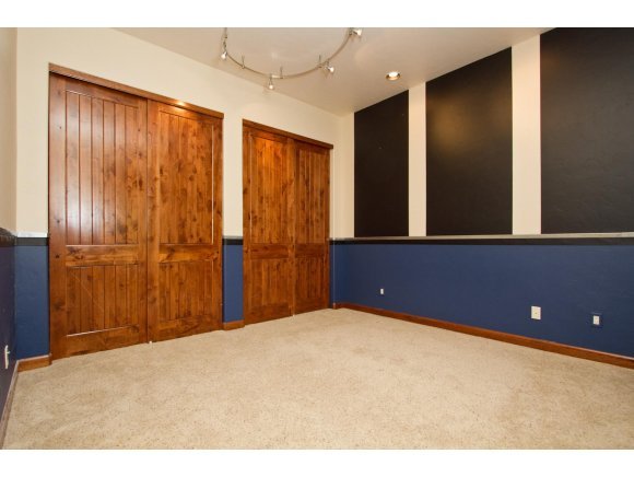 4465 Fort Bridger Road Prescott, AZ 86305 - Photo 20 of 23 a view of an empty room with wooden floor