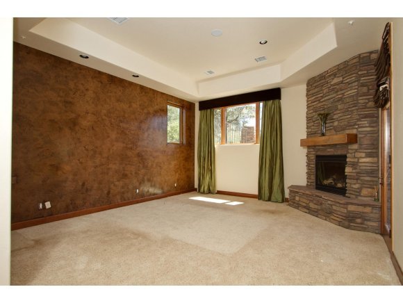 4465 Fort Bridger Road Prescott, AZ 86305 - Photo 9 of 23 a view of an empty room with a fireplace
