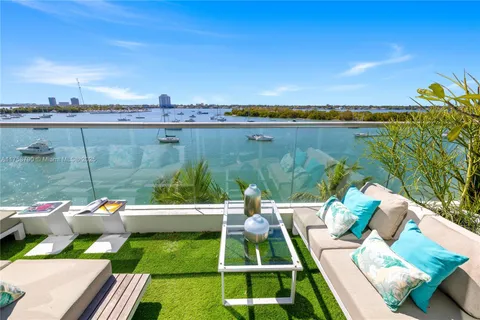 a view of yard from terrace with seating area