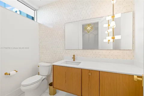 a view of a swimming pool with a patio and garden