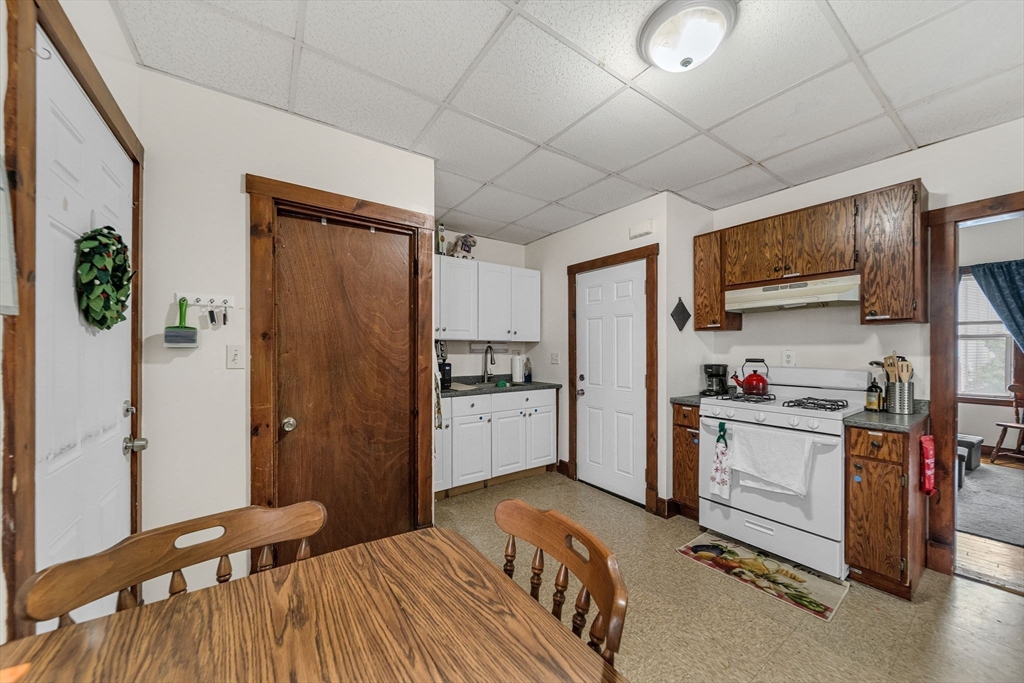 20 Autumn Street Somerville, MA 02145 - Photo 13 of 34 a kitchen with a refrigerator a stove top oven a sink and dishwasher