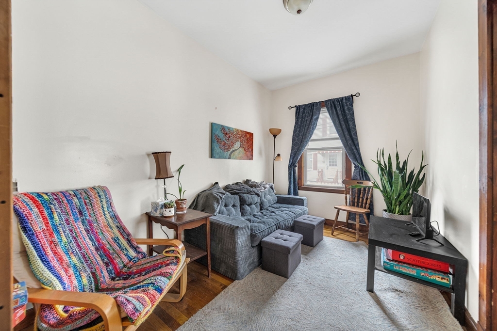 20 Autumn Street Somerville, MA 02145 - Photo 15 of 34 a living room with furniture and a potted plant