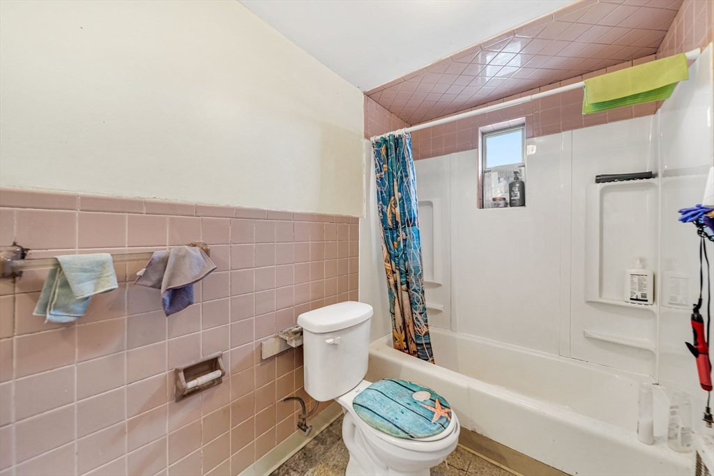 20 Autumn Street Somerville, MA 02145 - Photo 22 of 34 a bathroom with a toilet and a shower