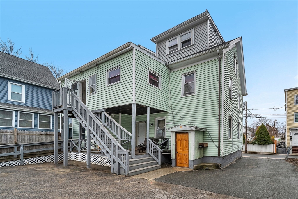 20 Autumn Street Somerville, MA 02145 - Photo 3 of 34 a front view of a house with a garage