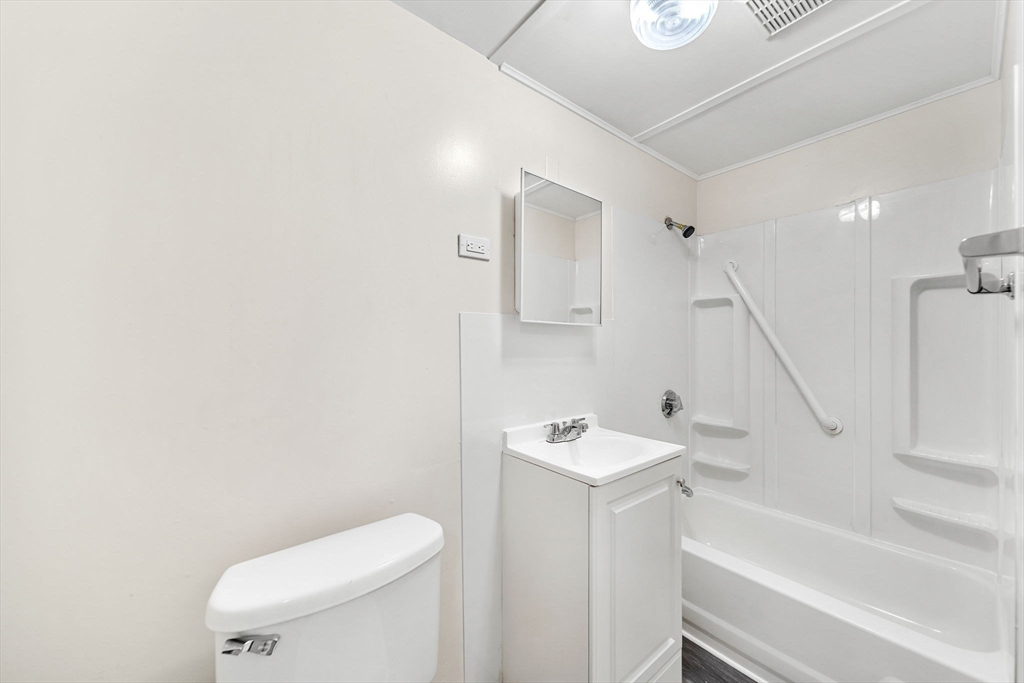 20 Autumn Street Somerville, MA 02145 - Photo 8 of 34 a white toilet sitting next to a bathroom sink