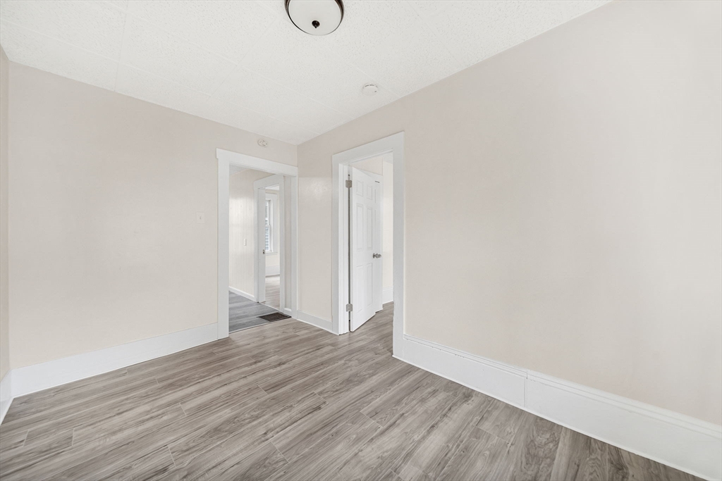 20 Autumn Street Somerville, MA 02145 - Photo 10 of 34 a view of an empty room with wooden floor