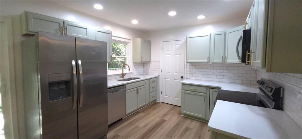 1774 Joe Black Road Sautee Nacoochee, GA 30571 - Photo 5 of 20 a kitchen with stainless steel appliances granite countertop a refrigerator and a sink