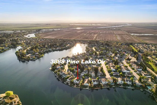an aerial view of a house with a lake view