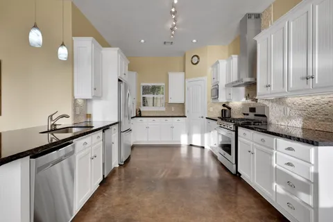 a large kitchen with cabinets
