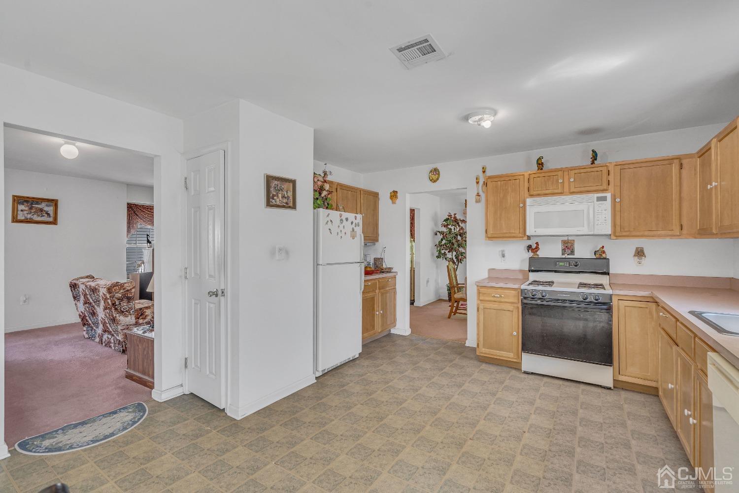 8 Fitzgerald Place Old Bridge, NJ 08857 - Photo 14 of 30 a kitchen with stainless steel appliances granite countertop a refrigerator and a stove top oven
