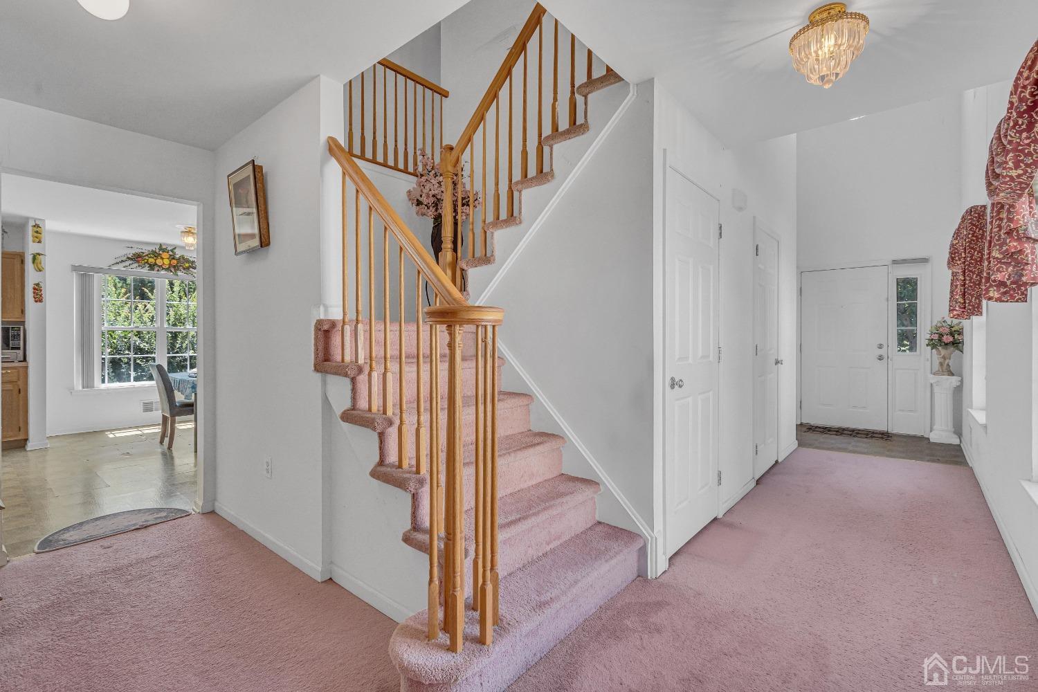 8 Fitzgerald Place Old Bridge, NJ 08857 - Photo 5 of 30 a view of a hallway with windows and stairs