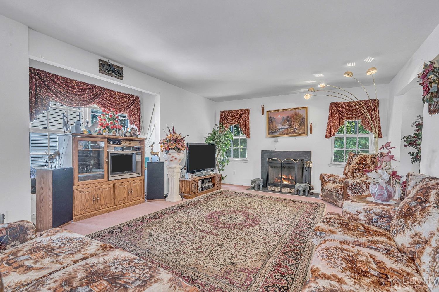 8 Fitzgerald Place Old Bridge, NJ 08857 - Photo 7 of 30 a living room with furniture and a fireplace