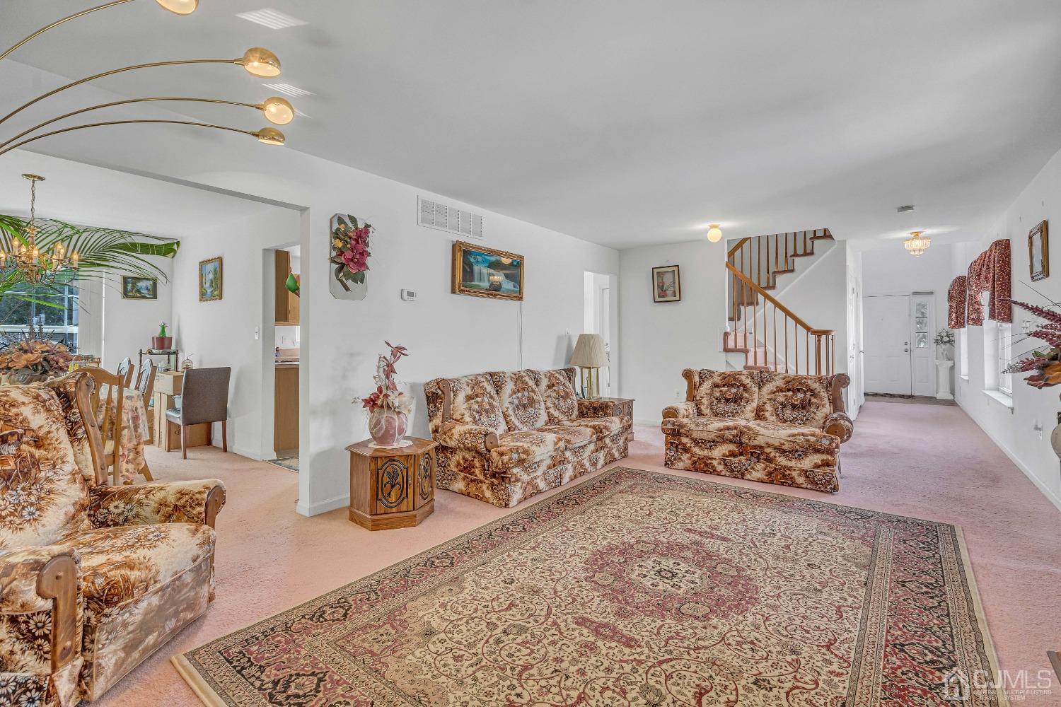 8 Fitzgerald Place Old Bridge, NJ 08857 - Photo 8 of 30 a living room with furniture and a chandelier
