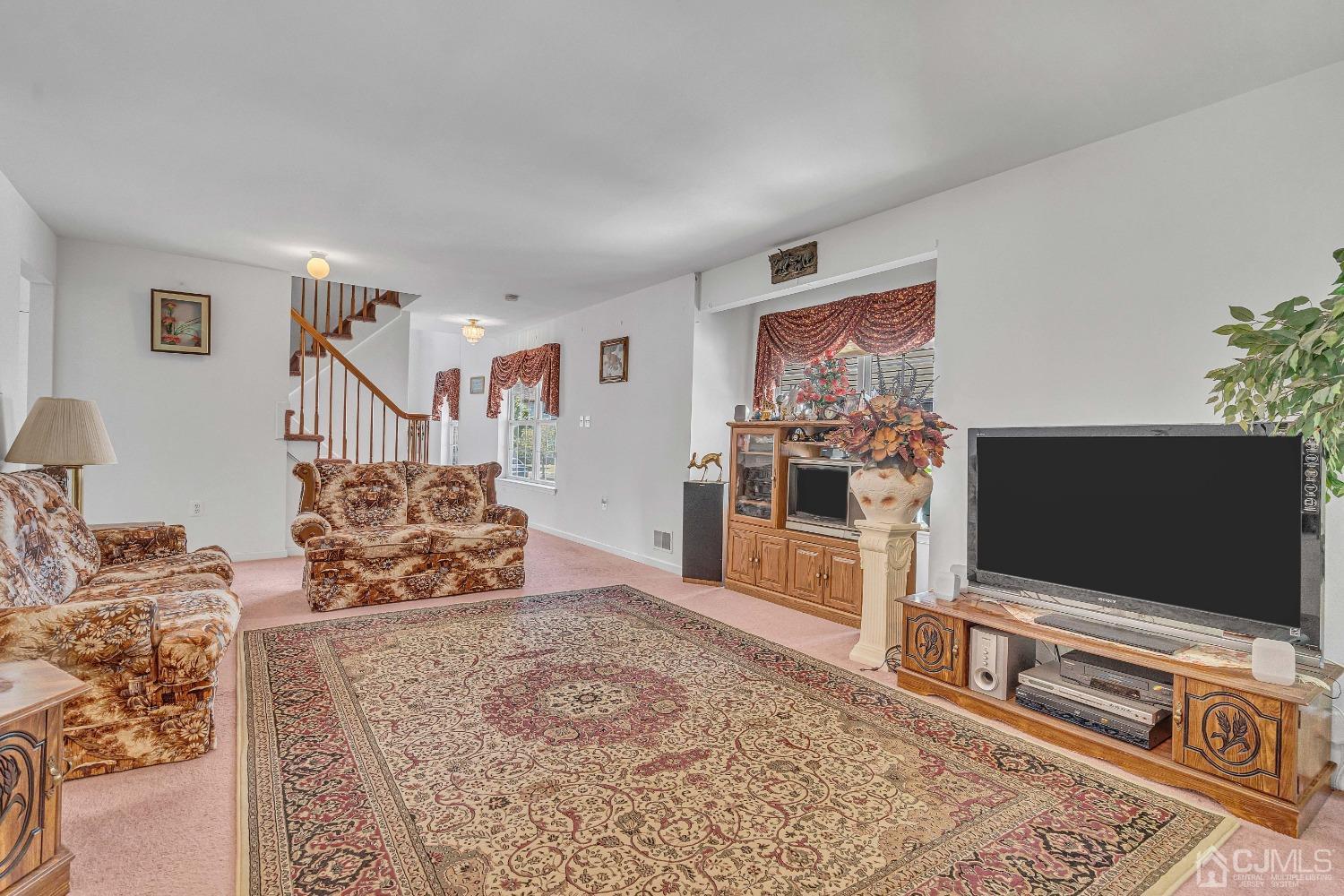 8 Fitzgerald Place Old Bridge, NJ 08857 - Photo 10 of 30 a living room with furniture and a flat screen tv