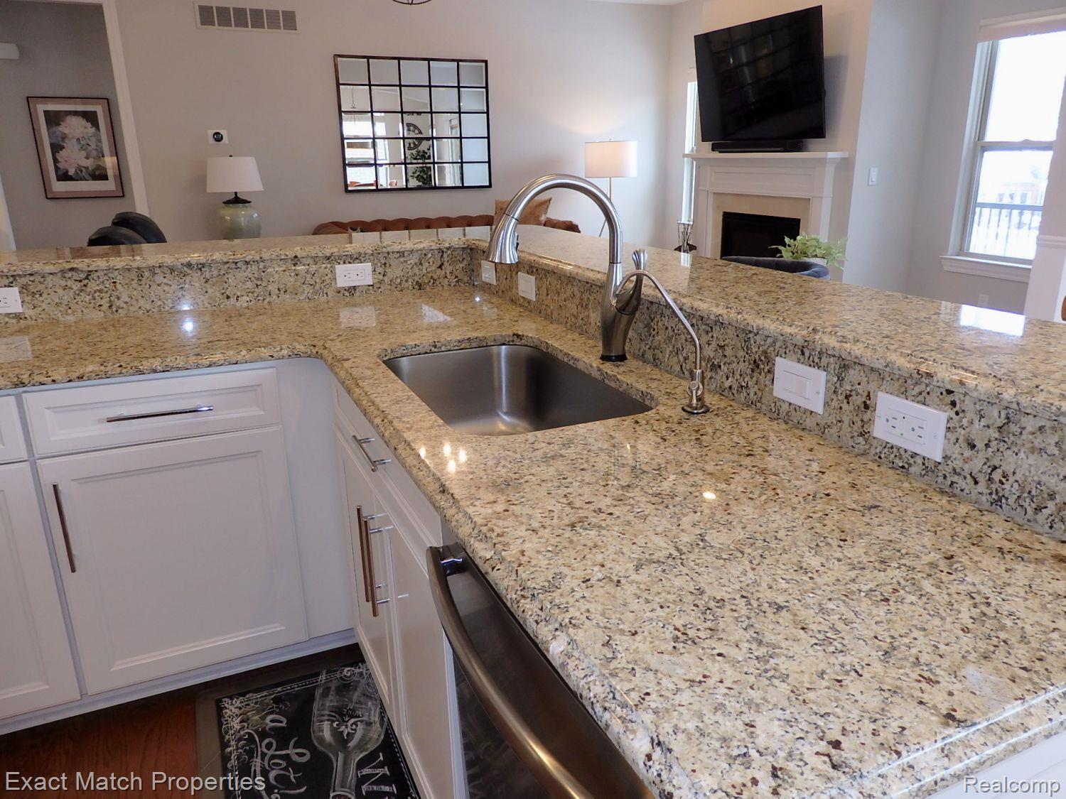 5496 Woodfall Road Clarkston, MI 48348 - Photo 24 of 51 Beautiful granite counter tops and snack bar