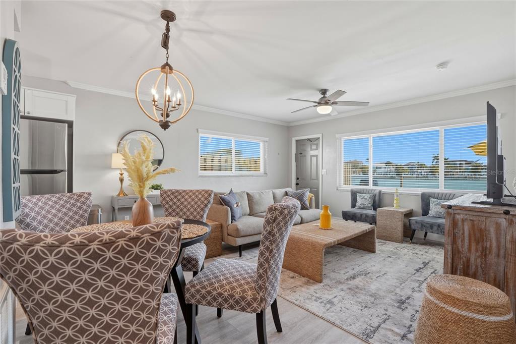 2605 Bay Boulevard Indian Rocks Beach, FL 33785 - Photo 19 of 82 a living room with furniture chandelier and a window