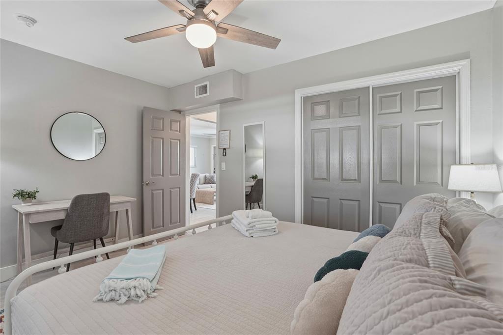 2605 Bay Boulevard Indian Rocks Beach, FL 33785 - Photo 22 of 82 a bedroom with a bed a desk and chair