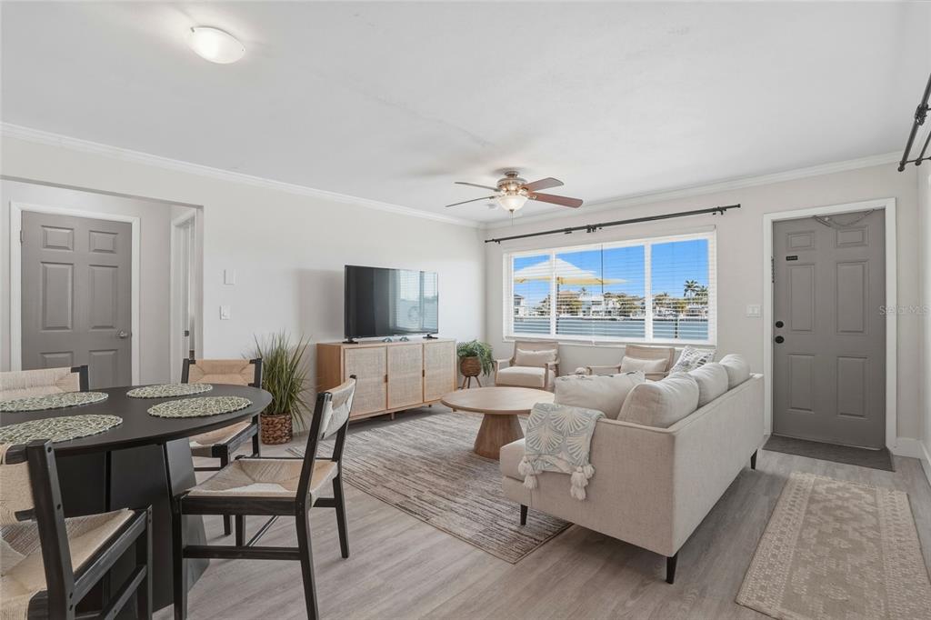 2605 Bay Boulevard Indian Rocks Beach, FL 33785 - Photo 35 of 82 a living room with furniture and a large window