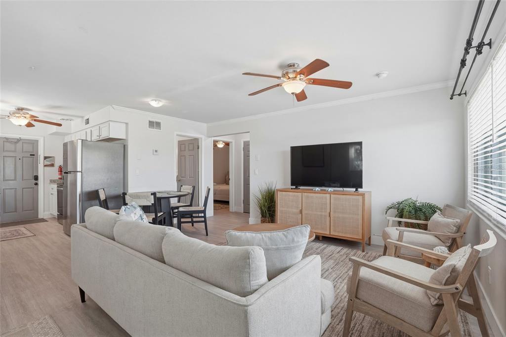 2605 Bay Boulevard Indian Rocks Beach, FL 33785 - Photo 36 of 82 a living room with furniture and a flat screen tv