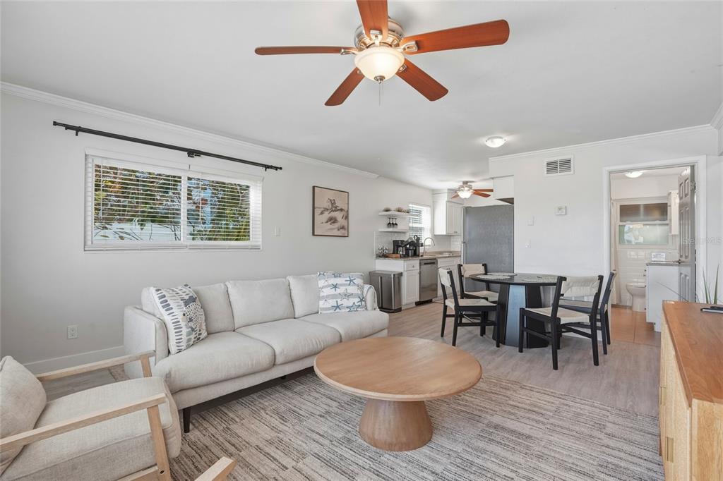 2605 Bay Boulevard Indian Rocks Beach, FL 33785 - Photo 37 of 82 a living room with furniture a wooden floor and a window