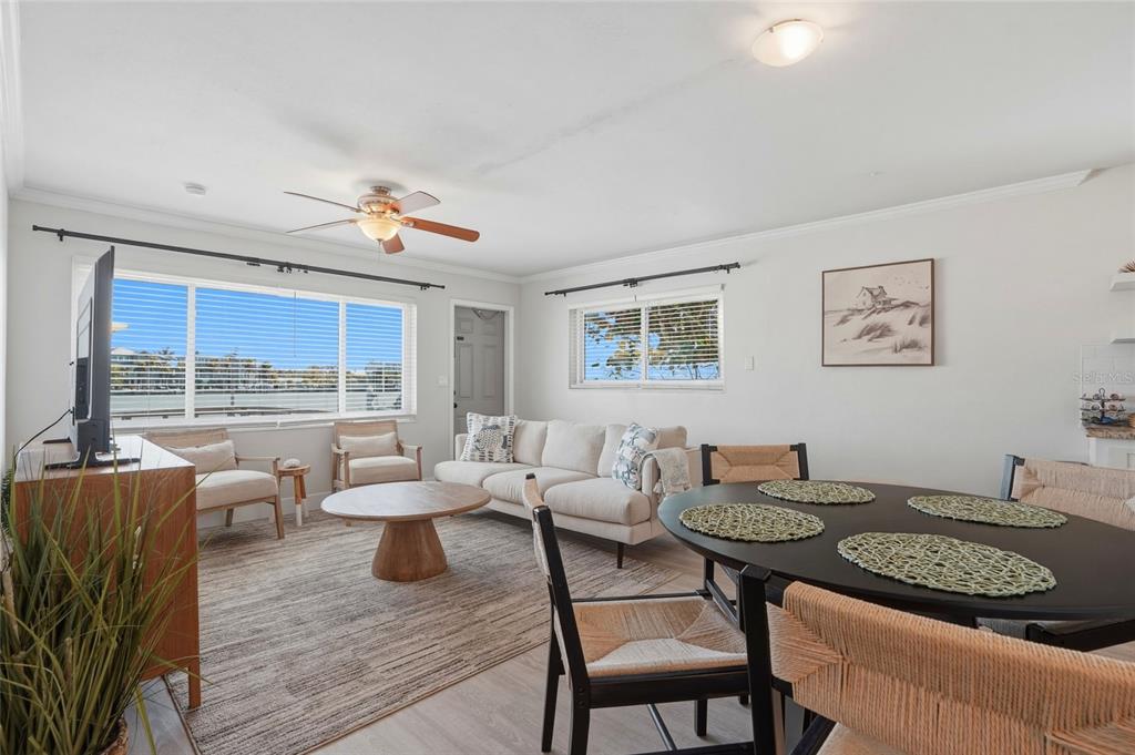 2605 Bay Boulevard Indian Rocks Beach, FL 33785 - Photo 38 of 82 a living room with furniture and a wooden floor