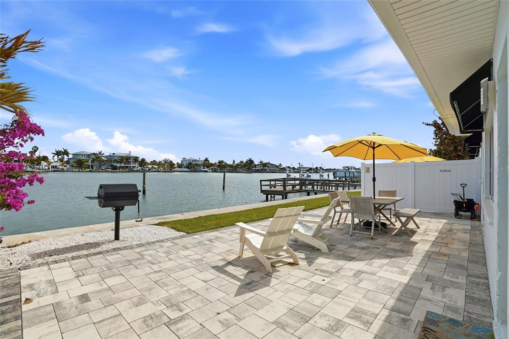 2605 Bay Boulevard Indian Rocks Beach, FL 33785 - Photo 4 of 82 a view of a swimming pool and lounge chairs