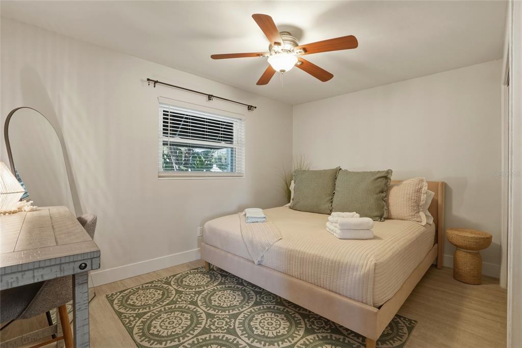 2605 Bay Boulevard Indian Rocks Beach, FL 33785 - Photo 44 of 82 a bedroom with a bed and a window