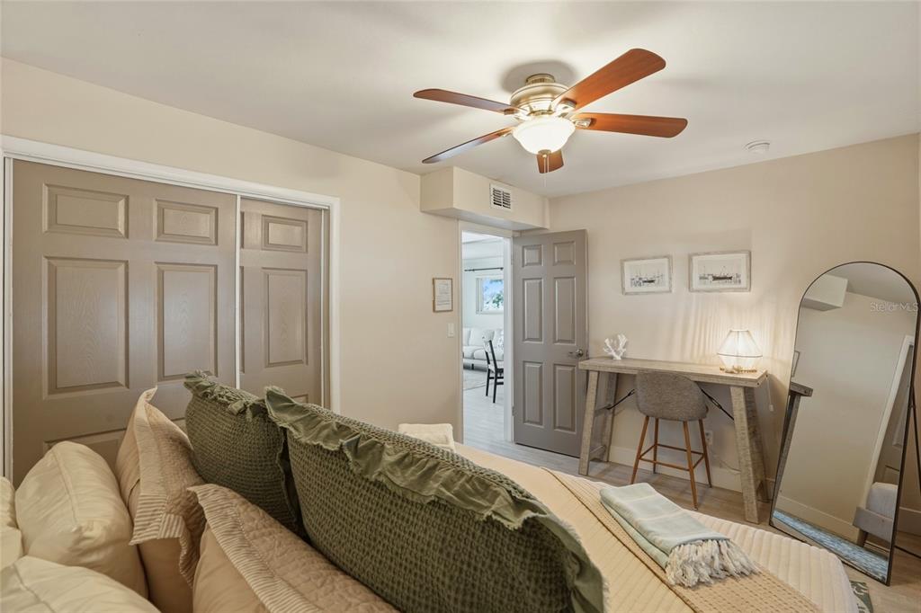 2605 Bay Boulevard Indian Rocks Beach, FL 33785 - Photo 45 of 82 a bed room with a bed couch and a window