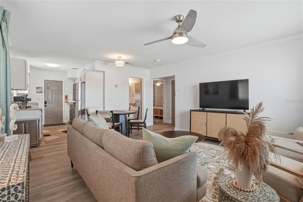 2605 Bay Boulevard Indian Rocks Beach, FL 33785 - Photo 56 of 82 a living room with furniture and a flat screen tv