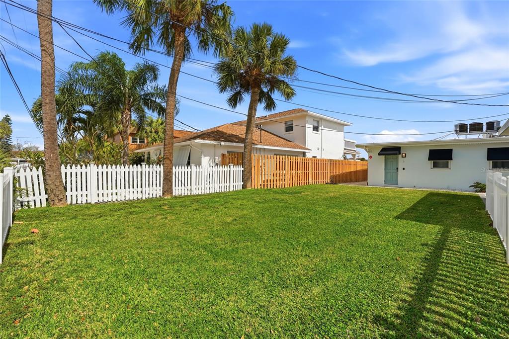 2605 Bay Boulevard Indian Rocks Beach, FL 33785 - Photo 82 of 82 a front view of a house with a garden