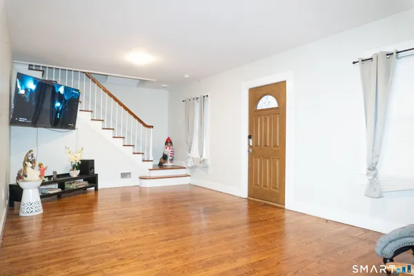 a view of an entryway and livingroom
