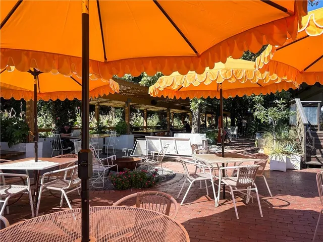 a view of a street with parked cars