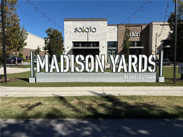 a view of a street with sitting area