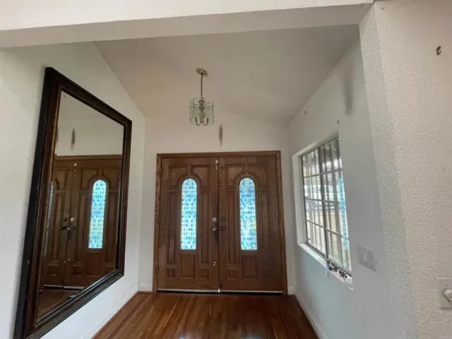 a view of entryway with wooden floor