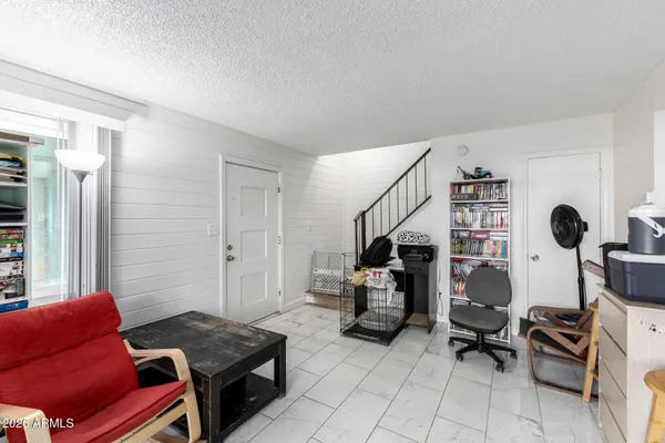 a kitchen with a table chairs and a stove