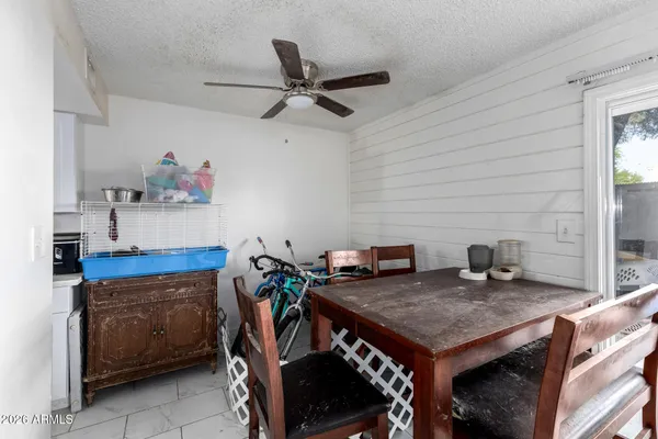 a view of a dining room with furniture and a chandelier