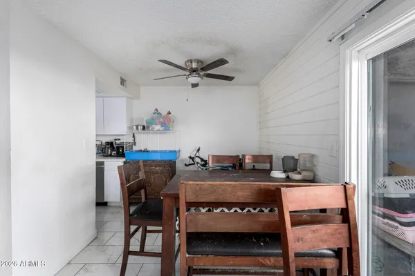 a kitchen with refrigerator and cabinets