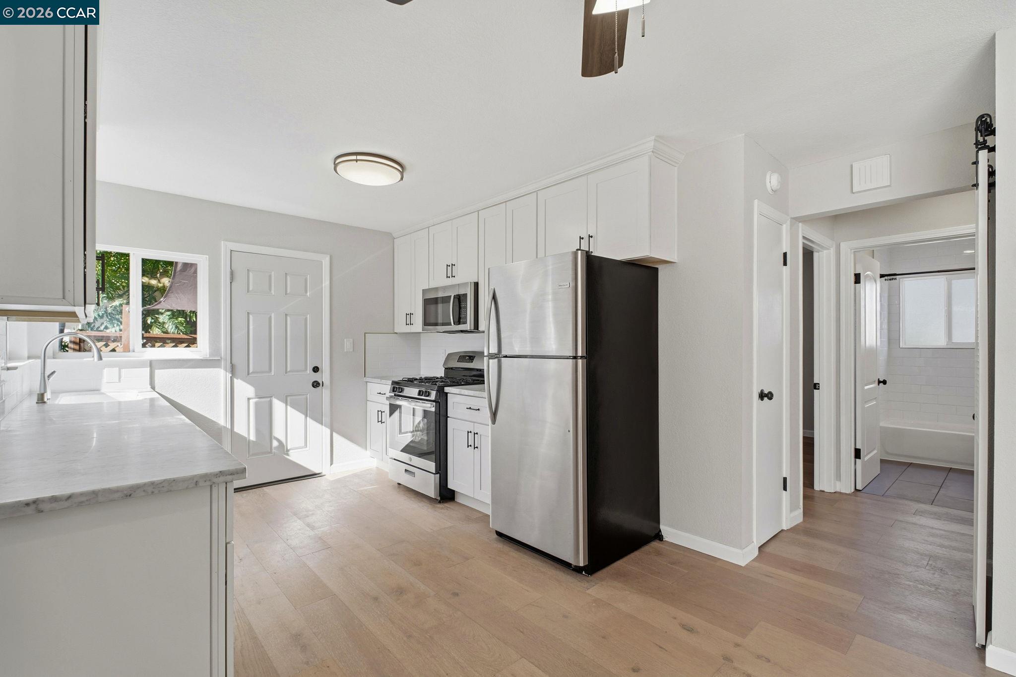 22824 High Street Hayward, CA 94541 - Photo 12 of 28 a kitchen with stainless steel appliances granite countertop a refrigerator and a sink