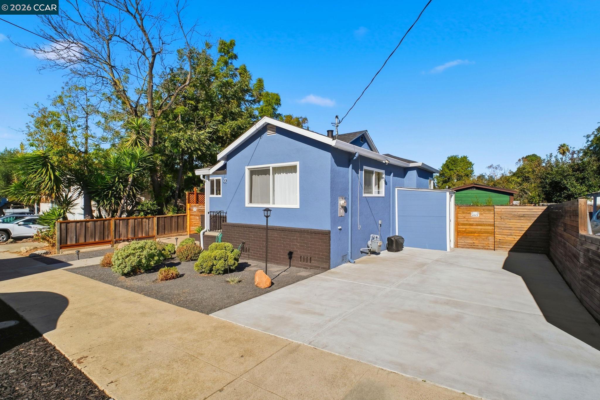 22824 High Street Hayward, CA 94541 - Photo 6 of 28 a front view of a house with a yard