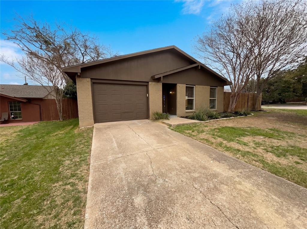 2005 Victoria Road Carrollton, TX 75007 - Photo 1 of 1 a front view of house with yard and trees