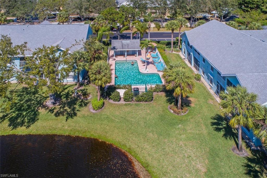 149 Wading Bird Circle, Unit I205 Naples, FL 34110 - Photo 20 of 27 an aerial view of a house with a yard basket ball court and outdoor seating