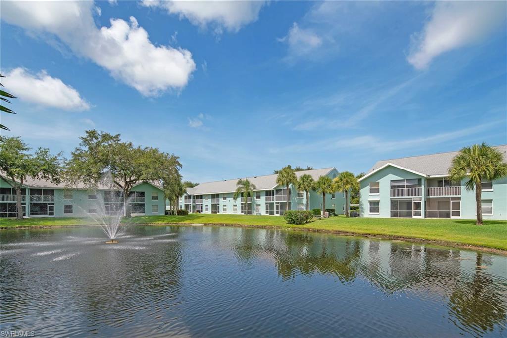 149 Wading Bird Circle, Unit I205 Naples, FL 34110 - Photo 24 of 27 a view of residential houses with lake view