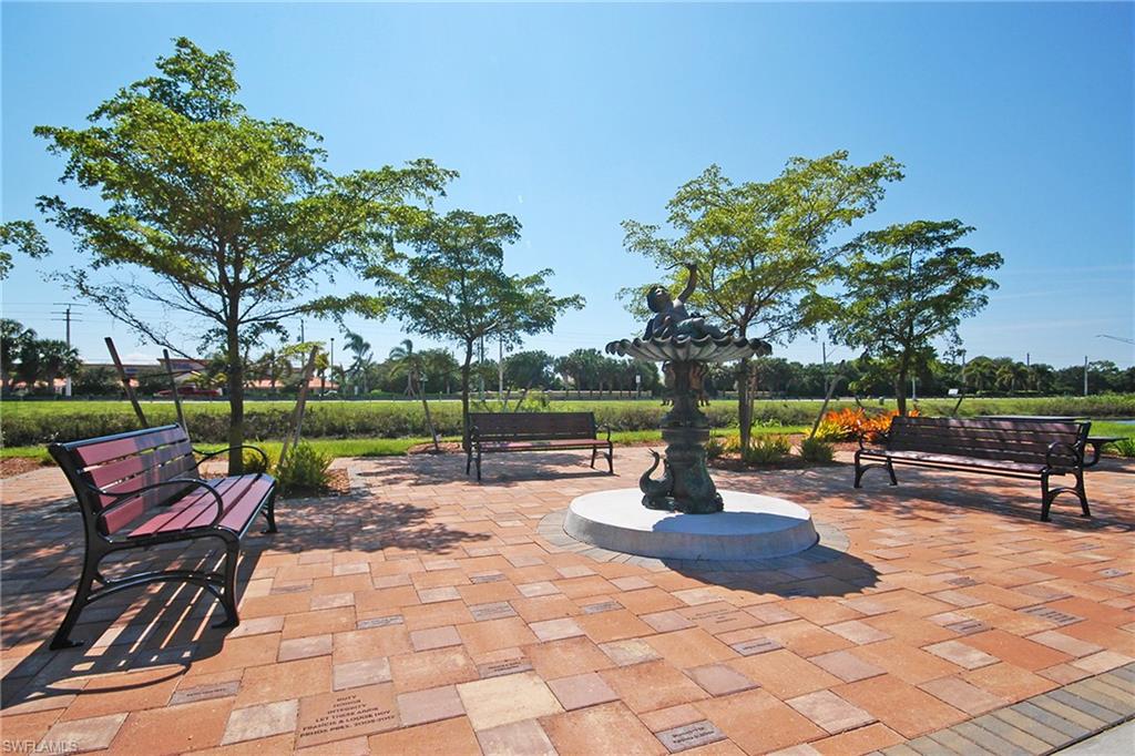 149 Wading Bird Circle, Unit I205 Naples, FL 34110 - Photo 27 of 27 a view of a park with sitting area